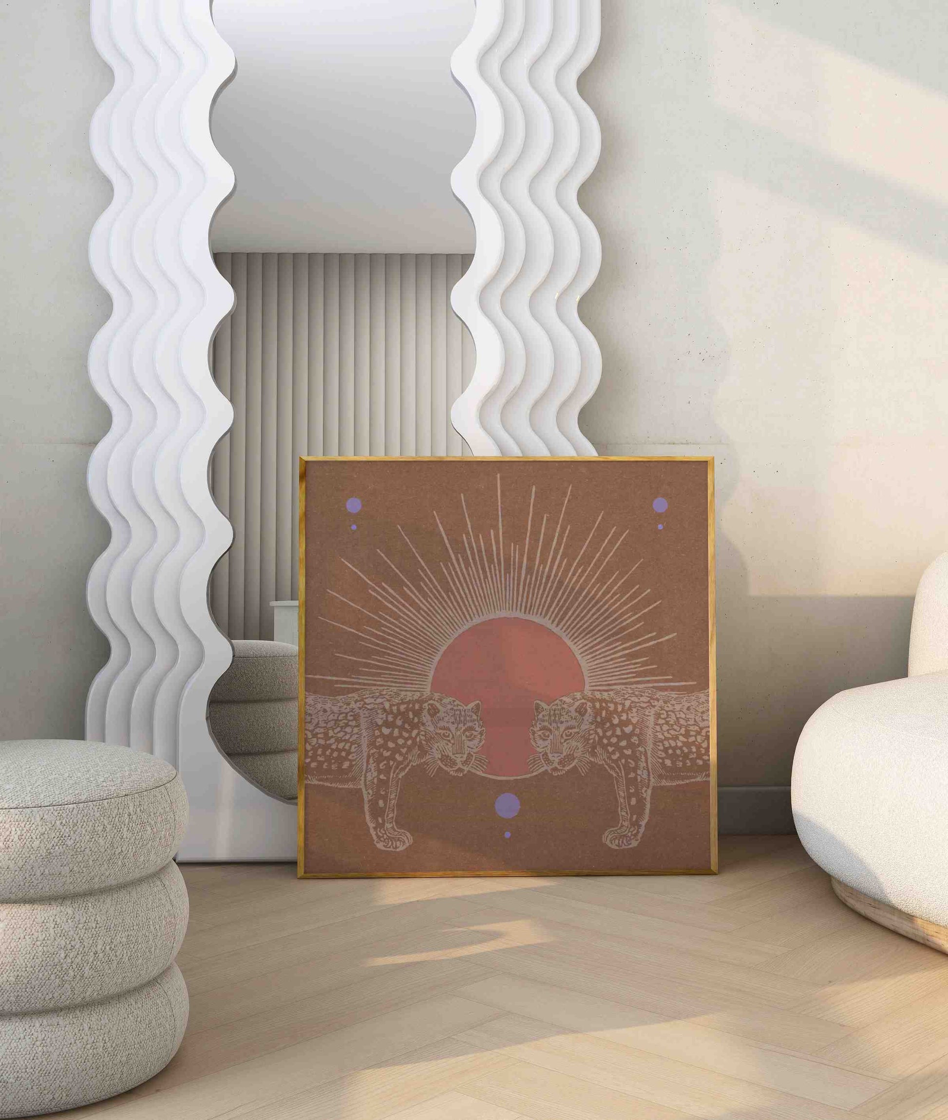 Framed boho poster with two cheetahs and a shining sun stands in the modern living room