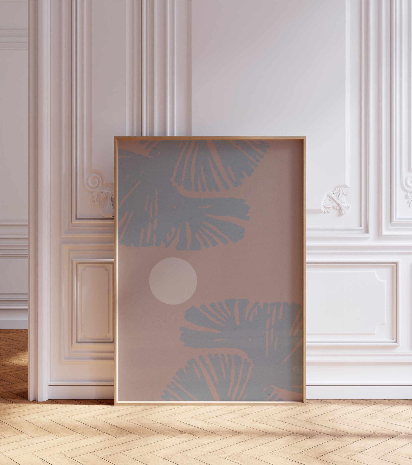 A boho style poster stands in a room with white walls with ornaments