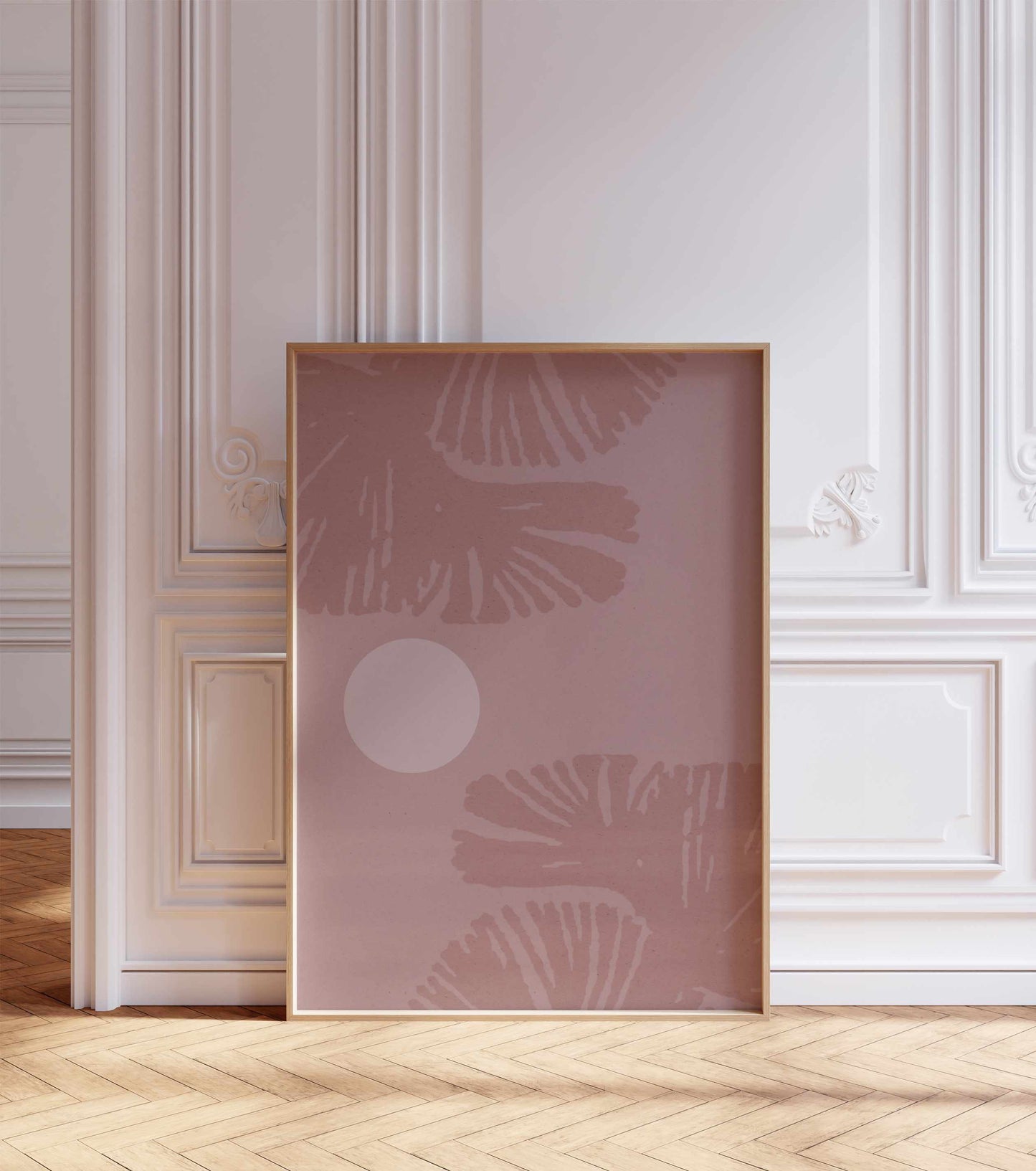 A boho style poster with a leaf motif, stands in a room with white walls with ornaments