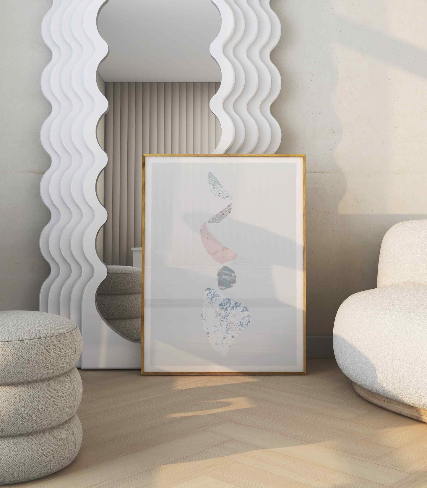 Framed abstract poster in shades of blue, orange, white, and gray stands in bright room