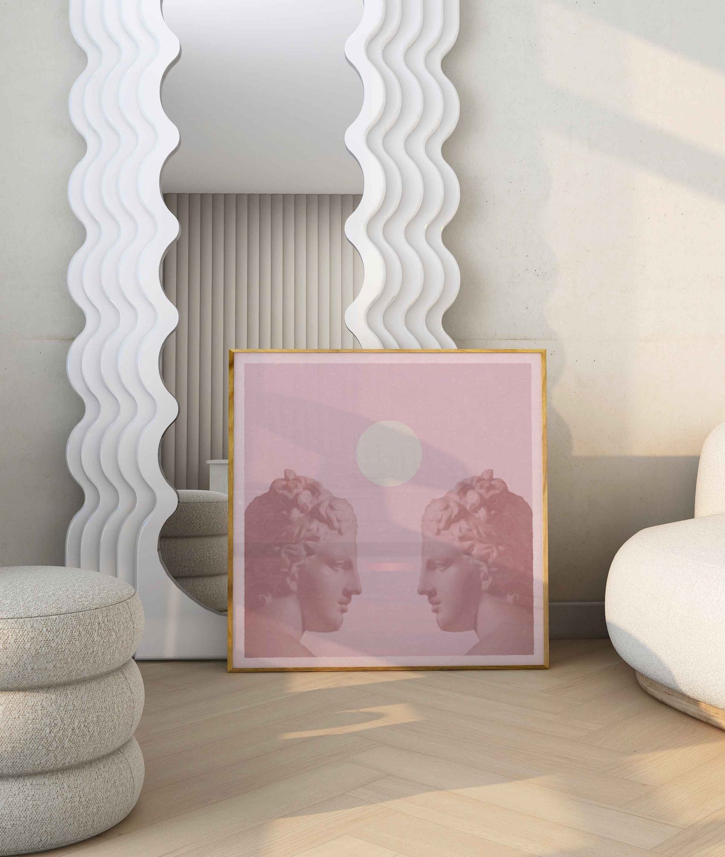 Framed poster in shades of pink with two women looking at each other, stands in a bright room