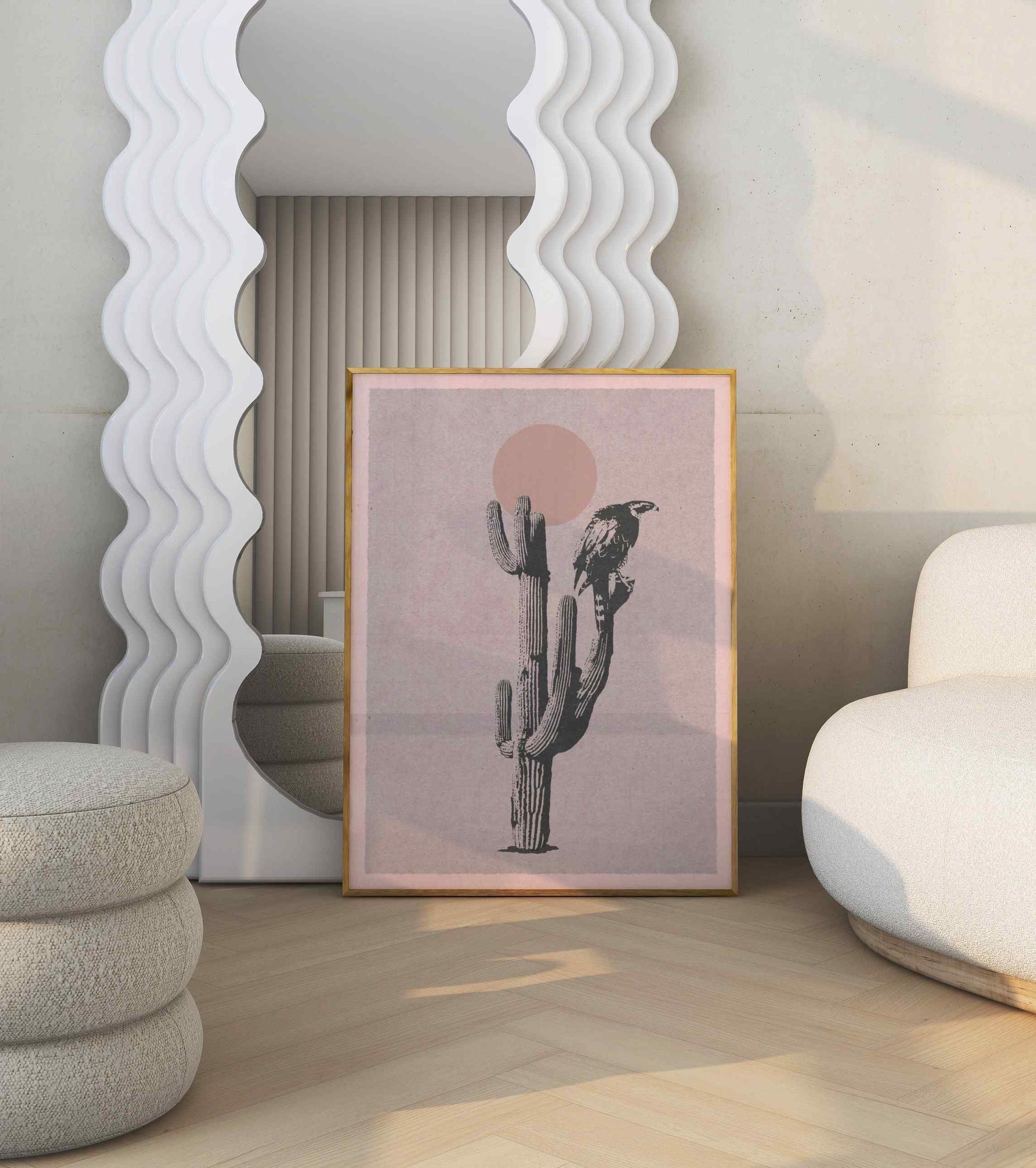 A poster with an illustration of a hawk sitting on a large cactus, stands in a modern bright room.