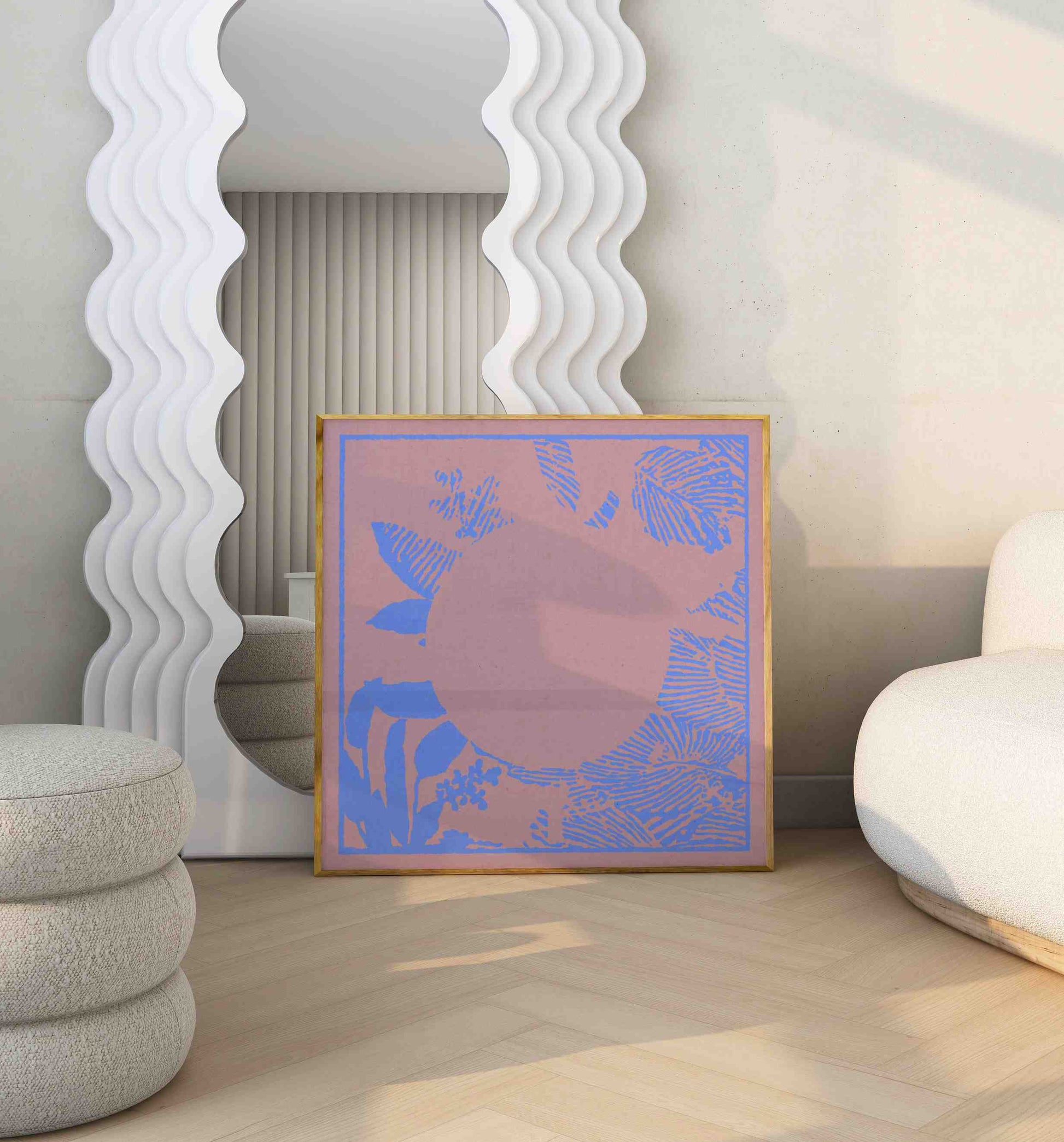 Framed boho poster with a botanical motif in peachy and blue colors stands in a modern room